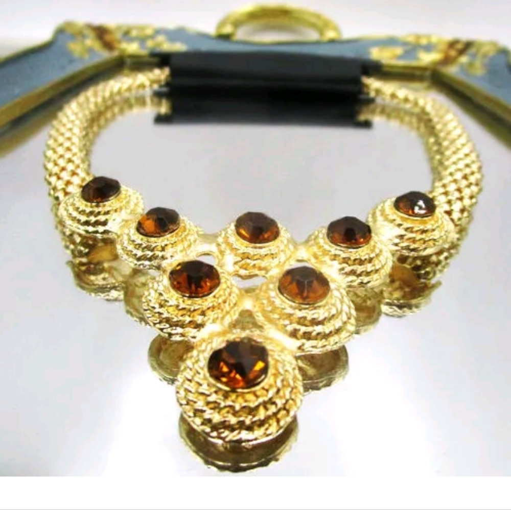 New goldtone with amber or black simulated stones necklace
